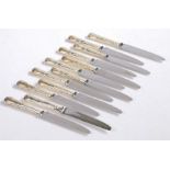Twelve Elizabeth II silver handled dessert knives, Sheffield 1960 and 1983, maker Walker & Hall,