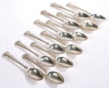 Twelve Elizabeth II silver dessert spoons, Sheffield 1960 and 1983, maker Walker & Hall, with