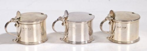 Five Elizabeth II silver mustard pots, London 1968, maker C.J. Vander Ltd. of drum form, the