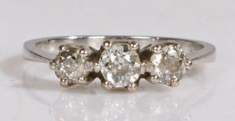 A platinum and diamond three stone ring, round brilliant cut diamonds with simple claw set mount,