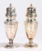 Pair of Elizabeth II silver sugar castors, Sheffield 1983, maker Walker & Hall, the scroll pierced