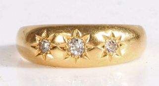 18 carat gold and diamond gypsy ring, the head set with three diamonds, the largest approx 0.09
