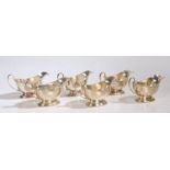 Six Elizabeth II silver sauceboats, Birmingham 1961, maker Walker & Hall, with loop handles and