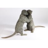 Cast metal sculpture depicting two meercats, modelled standing on their back legs, 82cm wide, 38cm