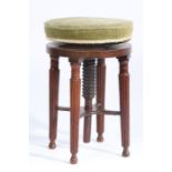 A Victorian mahogany piano stool, the circular adjustable top above four tapering reeded legs,