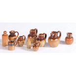Graduated set of six miniature Staffordshire stoneware jugs, the largest 27mm high, the smallest