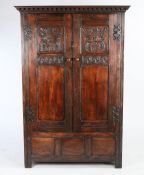 Oak cupboard made from a screen in a church in Appin, Scotland, the pair of oak panelled doors