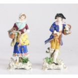 Pair of 19th century Sampson porcelain figures, depicting a man and woman holding baskets of flowers