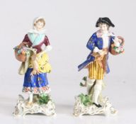 Pair of 19th century Sampson porcelain figures, depicting a man and woman holding baskets of flowers