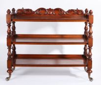 Victorian mahogany buffet, the shell and scroll carved upstand flanked by acorn finials, the three