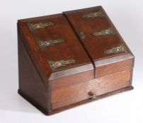 Art Nouveau oak stationary box, the sloping front with brass mounts opening to reveal a