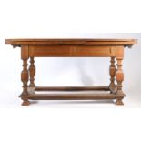 Victorian oak draw leaf table, the rectangular top with two draw leaves, raised on square