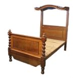 Victorian mahogany half tester bed, the arched canopy above the panelled bed frame with barley twist