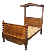 Victorian mahogany half tester bed, the arched canopy above the panelled bed frame with barley twist