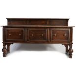 Large oak sideboard, 20th century, having a gallery back, the top above two deep drawers and centred