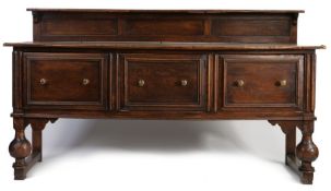 Large oak sideboard, 20th century, having a gallery back, the top above two deep drawers and centred