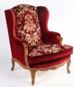 Early 20th Century French style wingback armchair, with foliate upholstered back and seat,