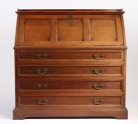 Morris & Co. mahogany bureau, the three-quarter upstand above a triple panelled fall opening to