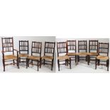 Nine Lancashire oak spindle back dining chairs, with woven rush seats, comprising one carver and