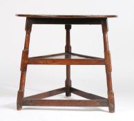 18th Century oak cricket table, the circular top raised on turned legs united by a triangular