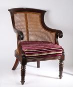 19th century mahogany and cane bergere chair, with a curved cresting rail above a cane back and seat