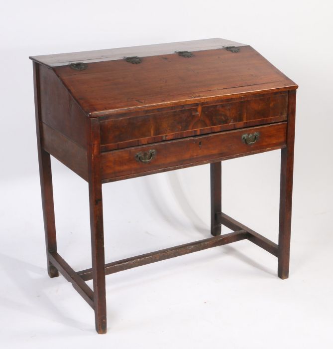 George III mahogany clerks desk, the hinged top above a frieze drawer with fall-front, raised on