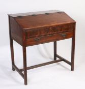 George III mahogany clerks desk, the hinged top above a frieze drawer with fall-front, raised on