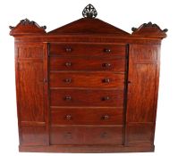 19th century mahogany compactum wardrobe, the moulded cornice above a drop front section with a