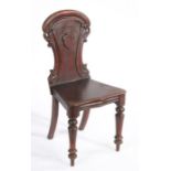 Victorian mahogany hall chair, the pierced scroll carved back with central vacant shield, the