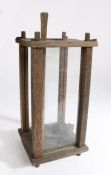 Early 20th century Swedish glazed lantern, centred with a candle holder, 30cm tall