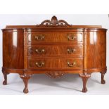 Eric Bates mahogany serpentine front sideboard, with pierced acanthus and shell carved upstand,