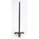 Chinese carved hardwood standard lamp, the tapering column carved with flower heads, raised on