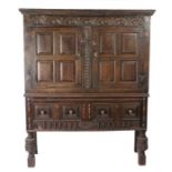 17th Century and later oak cupboard, the stepped pediment above a foliate and arch carved frieze,
