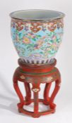 20th century Chinese red lacquered and cloisonne jardeniere stand and Chinese porcelain gold fish