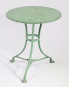 1920's French metal garden table, painted in green, the circular top raised on three outswept legs