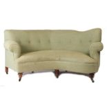 Edwardian parlour settee, upholstered in a woven green fabric, the shaped button back above a curved