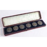 Set of six continental Art Nouveau silver buttons, with cast decoration depicting a young lady