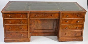 Edwardian walnut desk, the tooled green leather inset top above central frieze drawer and kneehole