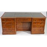 Edwardian walnut desk, the tooled green leather inset top above central frieze drawer and kneehole