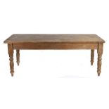 Victorian pine refectory table, the rectangular plank top above turned legs and plain stretchers,