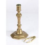 18th Century bronze candlestick, of octagonal form with tapering stem and flared foot, together with