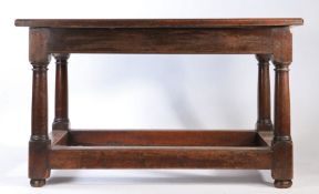 18th Century and later oak table, the two plank top raised on turned legs and substantial square