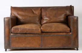 1920's brown leather club style settee, with studded upholstery, loose back and seat cushions, 135cm
