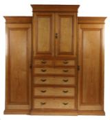 Victorian ash compactum, of breakfront form with stepped pediment, two central cupboard doors
