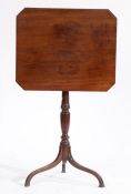 George III mahogany occasional table, the tilt-top with canted corners, raised on a turned fluted