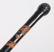Japanese painted bamboo walking stick, the top with a burred design above a carved snake to the