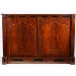 A Regency mahogany press cupboard, the rectangular top above an inlaid frieze and a pair of strung