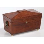 Regency mahogany and crossbanded tea caddy, circa 1810, of sarcophagus form the hinged lid opening