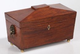 Regency mahogany and crossbanded tea caddy, circa 1810, of sarcophagus form the hinged lid opening