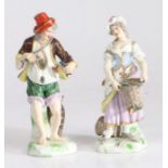 Pair of 19th century Dresden figures, depicting a fisherman holding two fish and with a fish